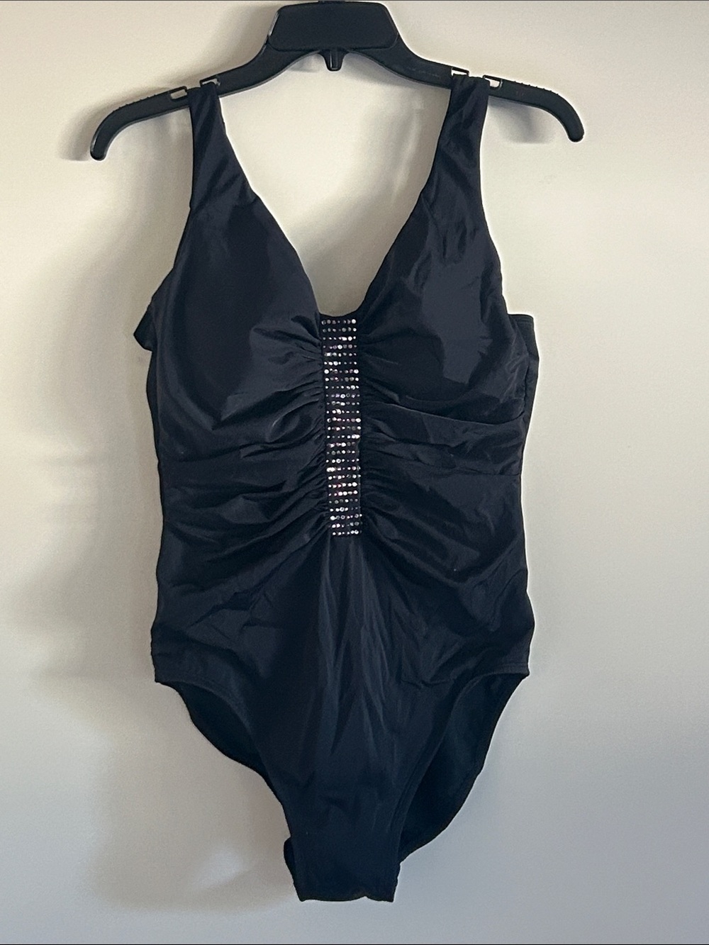 NWOT.  Trimshaper Women’s One Piece Black Swimsuit with Crystal design.